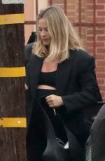 Pregnant MARGOT ROBBIE Arrives at an Office Building in Santa Monica 10/01/2024