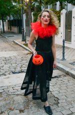AMBER HEARD in a Quirky Clown Make-up and a Huge Red Ruff Collar Celebrates Halloween 10/31/2024