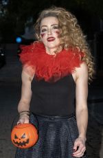 AMBER HEARD in a Quirky Clown Make-up and a Huge Red Ruff Collar Celebrates Halloween 10/31/2024