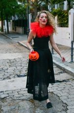 AMBER HEARD in a Quirky Clown Make-up and a Huge Red Ruff Collar Celebrates Halloween 10/31/2024