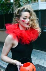 AMBER HEARD in a Quirky Clown Make-up and a Huge Red Ruff Collar Celebrates Halloween 10/31/2024