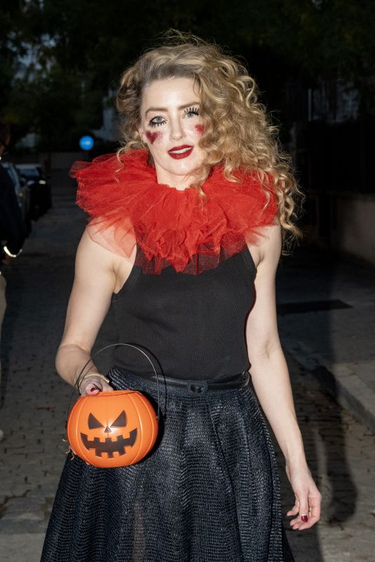 AMBER HEARD in a Quirky Clown Make-up and a Huge Red Ruff Collar Celebrates Halloween 10/31/2024