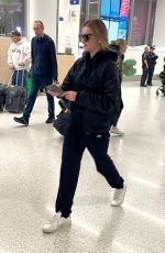 ANNA DELVEY Arrives at LAX Airport in Los Angeles 11/23/2024