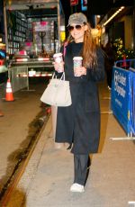 KATIE HOLMES Carries Two Coffees from Starbucks Out in New York City 11/26/2024