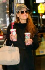 KATIE HOLMES Carries Two Coffees from Starbucks Out in New York City 11/26/2024