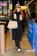 KATIE HOLMES Carries Two Coffees from Starbucks Out in New York City 11/26/2024
