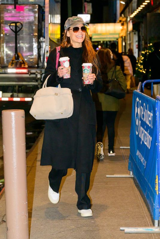 KATIE HOLMES Carries Two Coffees from Starbucks Out in New York City 11/26/2024