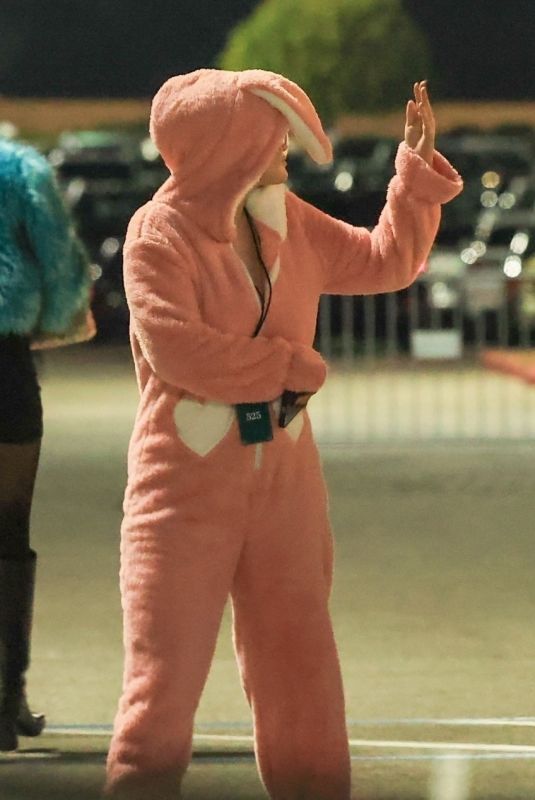 SELENA GOMEZ in a Pink Bunny Onesie Arrives at Sabrina Carpenter’s Short n’ Sweet Concert at Kia Forum in Inglewood 11/17/2024