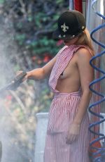 ADDISON RAE Washes Her Car in Los Angeles 12/01/2024