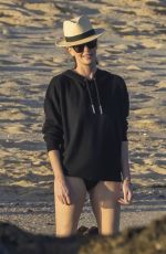 CHARLIZE THERON in Swimsuit at a Beach on Vacation in Mexico 12/28/2024