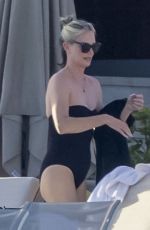 CHARLIZE THERON in Swimsuit at a Beach on Vacation in Mexico 12/28/2024