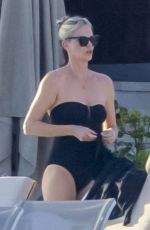 CHARLIZE THERON in Swimsuit at a Beach on Vacation in Mexico 12/28/2024