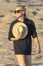 CHARLIZE THERON in Swimsuit at a Beach on Vacation in Mexico 12/28/2024