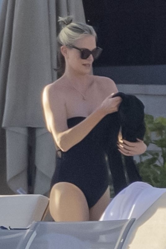CHARLIZE THERON in Swimsuit at a Beach on Vacation in Mexico 12/28/2024