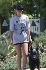 DAKOTA JOHNSON Walks Her Dog Out in Malibu 12/19/2024