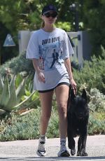 DAKOTA JOHNSON Walks Her Dog Out in Malibu 12/19/2024