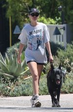 DAKOTA JOHNSON Walks Her Dog Out in Malibu 12/19/2024