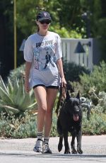 DAKOTA JOHNSON Walks Her Dog Out in Malibu 12/19/2024