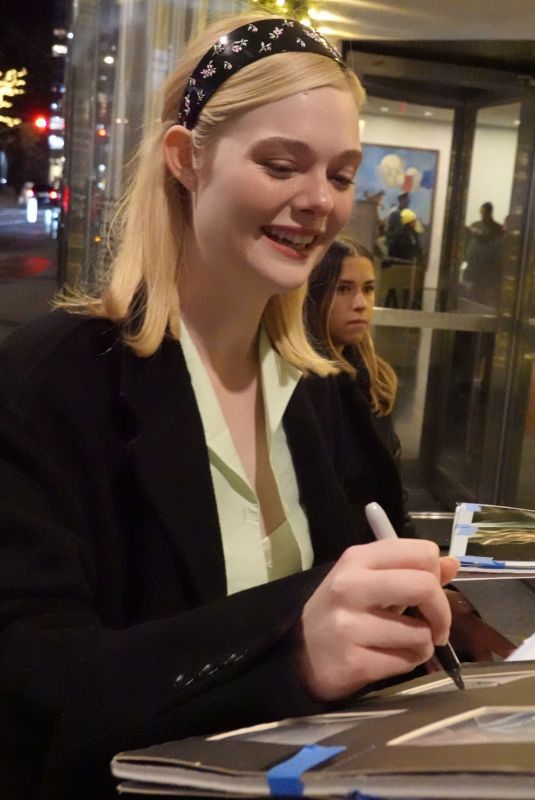 ELLA FANNING Sign Autographs for Her Fans Out in Manhattan 12/15/2024