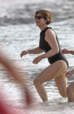 EMMA FORNBES in Swimsuit Enjoys a Christmas Break on the Beach at Sandy Lane Hotel in Barbados 12/23/2024