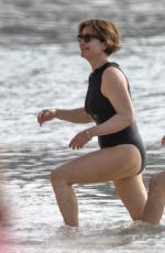 EMMA FORNBES in Swimsuit Enjoys a Christmas Break on the Beach at Sandy Lane Hotel in Barbados 12/23/2024