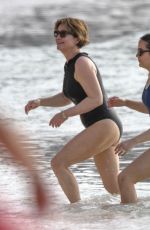EMMA FORNBES in Swimsuit Enjoys a Christmas Break on the Beach at Sandy Lane Hotel in Barbados 12/23/2024