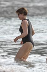 EMMA FORNBES in Swimsuit Enjoys a Christmas Break on the Beach at Sandy Lane Hotel in Barbados 12/23/2024