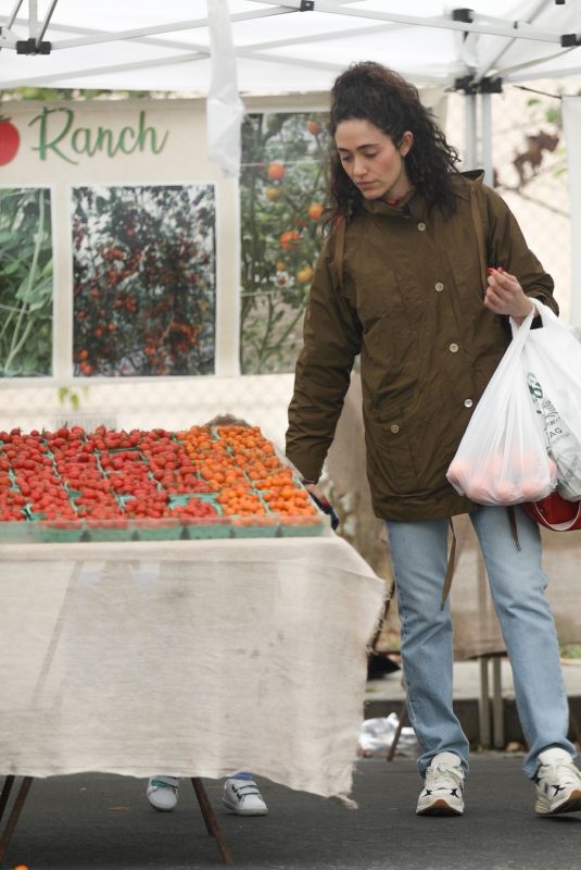 EMMY ROSSUM Picking up Fresh Fruit at Farmer’s Market in Los Angeles 12/29/2024