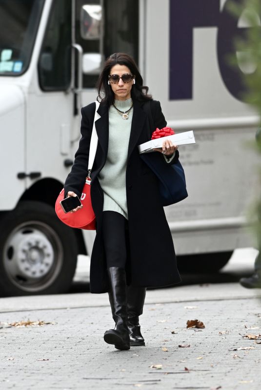 HUMA ABEDIN Out with a Christmas Gift in New York 12/19/2024