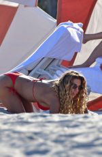 JENA FRUMES in a Red Bikini at a Beach in Miami Beach 12/21/2024