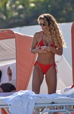 JENA FRUMES in a Red Bikini at a Beach in Miami Beach 12/21/2024