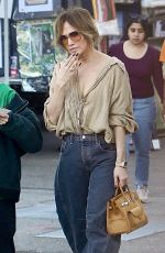 JENNIFER LOPEZ Enjoys a Candy Cane While Shopping in West Hollywood 12/01/2024