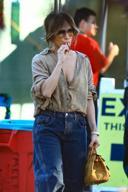 JENNIFER LOPEZ Enjoys a Candy Cane While Shopping in West Hollywood 12/01/2024