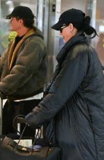KATY PERRY and Orlando Bloom Arrives at JFK Airport in New York City 12/12/2024