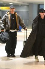 KATY PERRY and Orlando Bloom Arrives at JFK Airport in New York City 12/12/2024