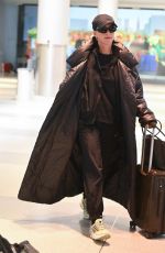 KATY PERRY and Orlando Bloom Arrives at JFK Airport in New York City 12/12/2024