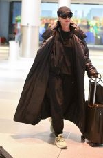 KATY PERRY and Orlando Bloom Arrives at JFK Airport in New York City 12/12/2024