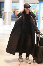 KATY PERRY and Orlando Bloom Arrives at JFK Airport in New York City 12/12/2024