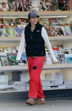 LISA RINNA Checking Out Magazines at a News Stand in Los Angeles 11/30/2024