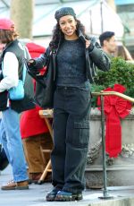 LIZA KOSHY on the Set of The Man with the Bag with Arnold Schwarzenegger, Alan Ritchson and KYLE MOONEY in Bryant Park in New York 12/19/2024