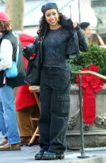 LIZA KOSHY on the Set of The Man with the Bag with Arnold Schwarzenegger, Alan Ritchson and KYLE MOONEY in Bryant Park in New York 12/19/2024