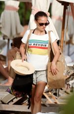 NATALIE PORTMAN in Bikini at a Beach in St Barts 12/24/2024