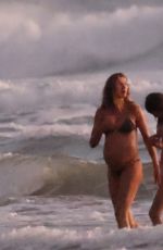 Pregnant GISELE BUNDCHEN in Bikini with Joaquim Valente at Their Family Holiday Break 12/24/2024