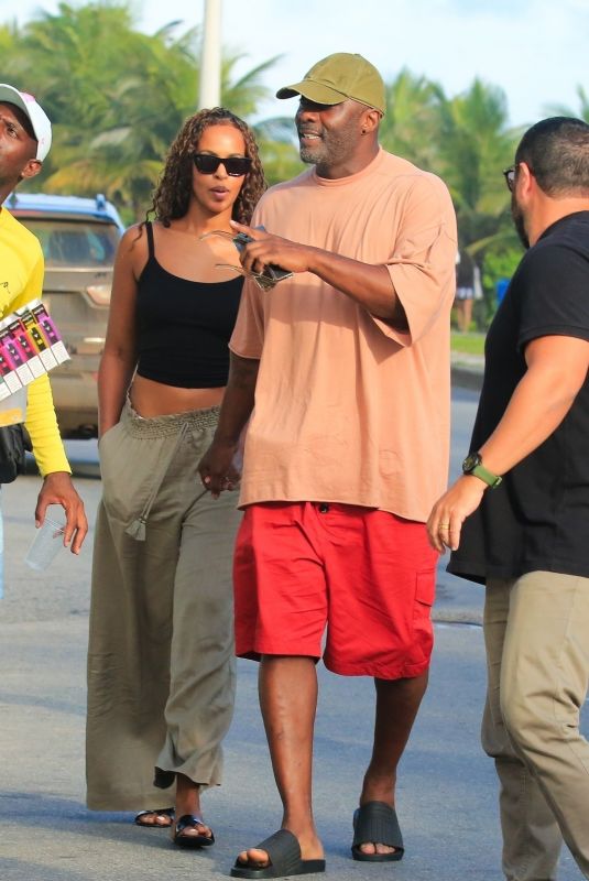 SABRINA DHOWRE and Idris ELBA at Barra da Tijuca in Rio de Janeiro 12/30/2024