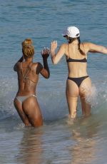 VITTORIA CERETTI and JUSTINE SKYE in Bikinis on the Beach in St. Barts 12/29/2024