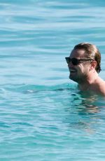 VITTORIA CERETTI in Bikini and Leonardo DiCaprio at a Beach in St. Barts 12/28/2024