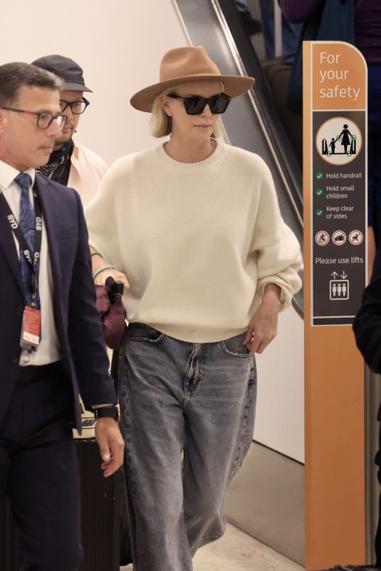 CHARLIZE THERON Arrives In Sydney to Film Netflix