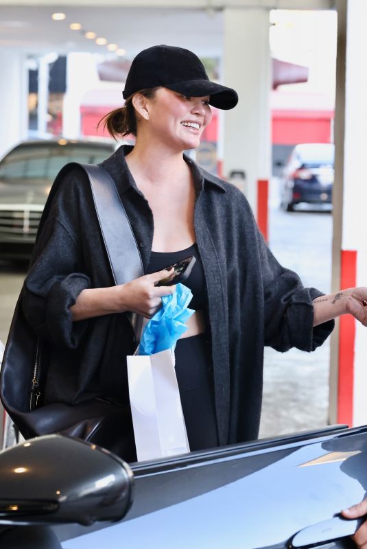 CHRISSY TEIGEN Visits Dermatologist Before Stopping at Valet in Beverly Hills 01/23/2025
