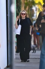 DAKOTA FANNING Out Shopping on Melrose Place with David Bernard 01/02/2025