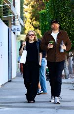 DAKOTA FANNING Out Shopping on Melrose Place with David Bernard 01/02/2025